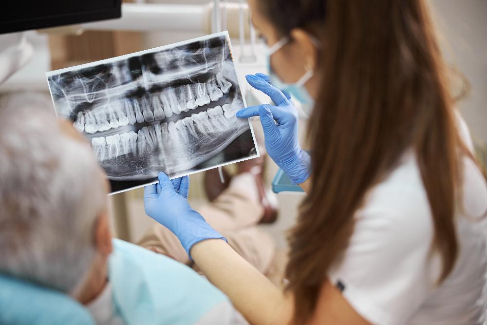 Woman looking at dental x-ray with patient, centerville oh
