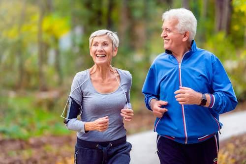 Older man and woman running after full mouth reconstruction, centerville oh