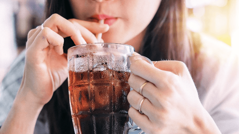Woman drinking soda with a straw, centerville oh
