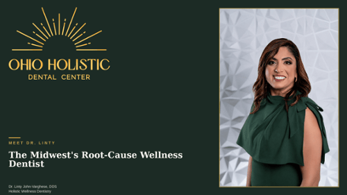Dr. Linty John-Varghese, holistic wellness dentist , smiling in a green dress