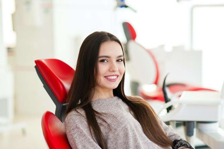 Woman smiling in dentist chair before cosmetic dentistry, centerville oh