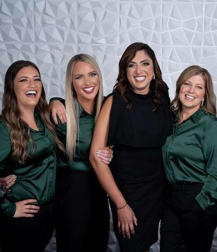 Ohio holistic dental center staff smiling together, centerville oh
